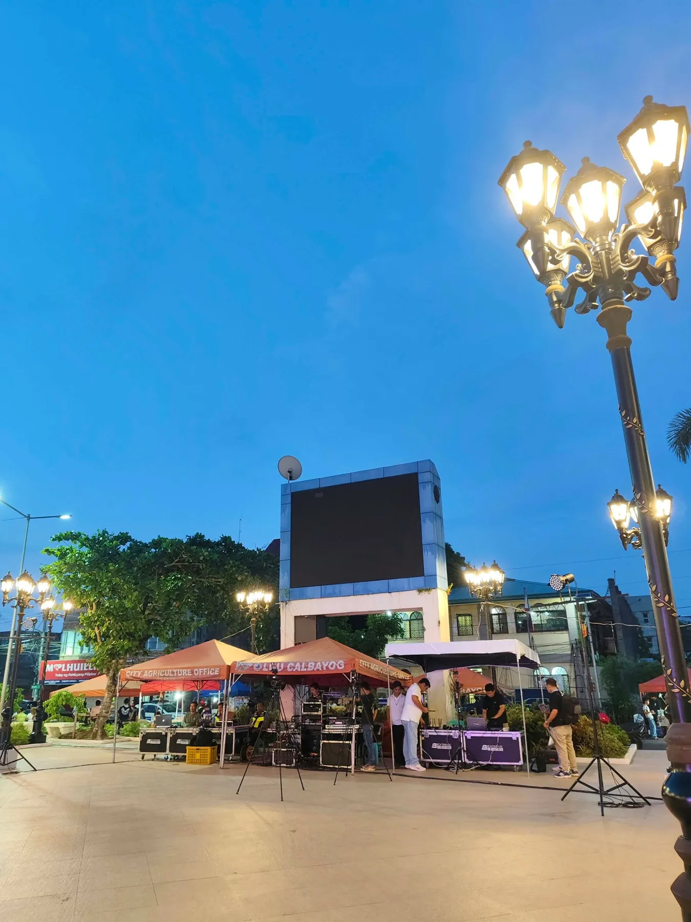 Tents and the big screen at Julio Cardinal Rosales Plaza before the Charter Day opening program